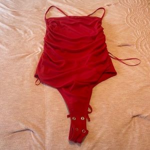 Runched red body suit
